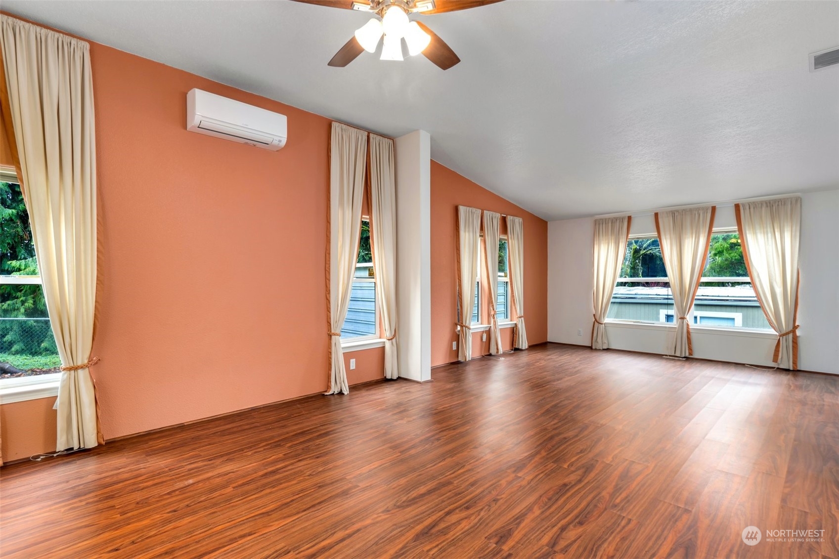 3324 206th Place Southeast Bothell, WA 98012 - Photo 16 of 34 an empty room with wooden floor and windows