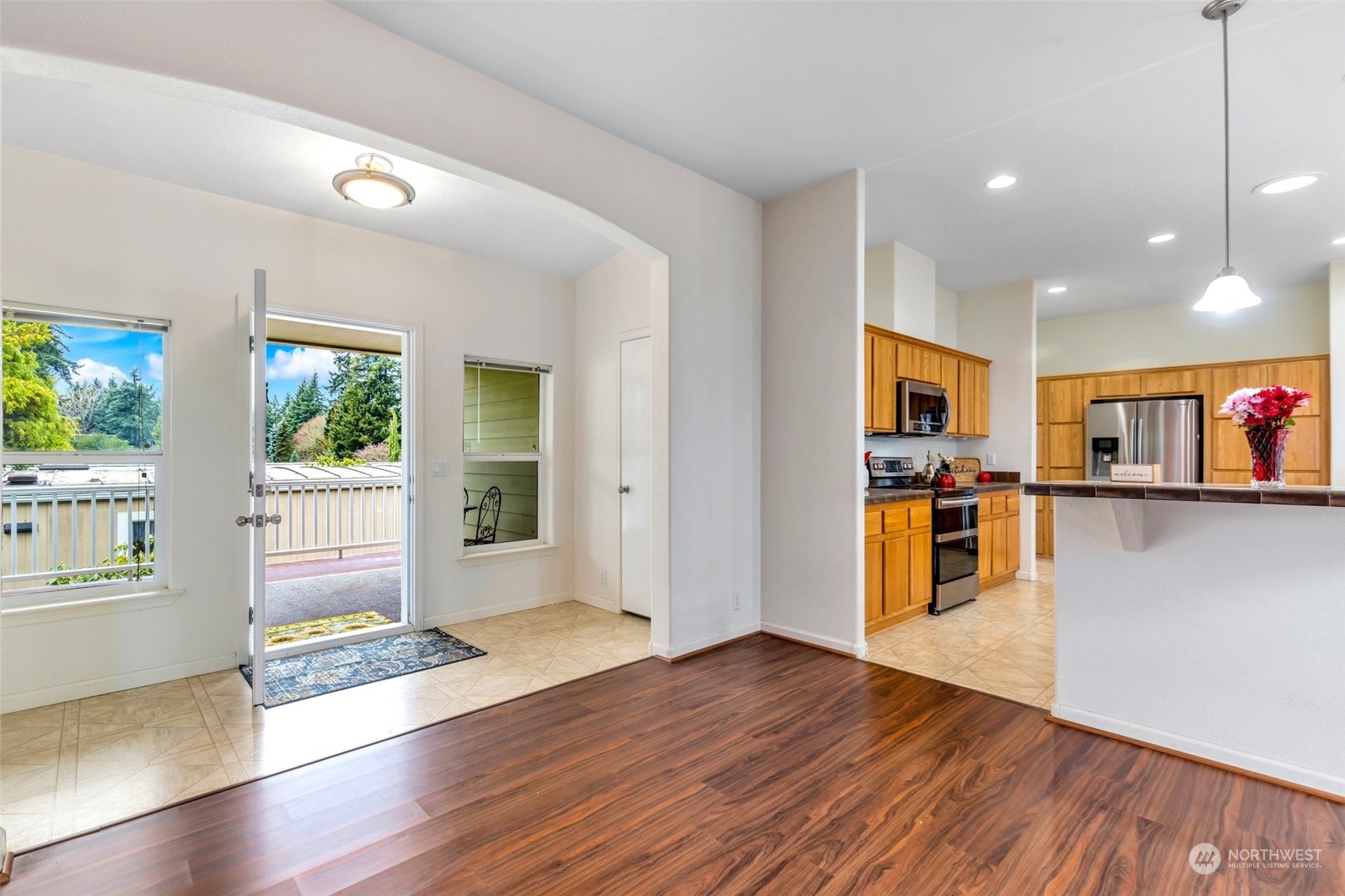 3324 206th Place Southeast Bothell, WA 98012 - Photo 5 of 34 a view of a kitchen with wooden floor and a window