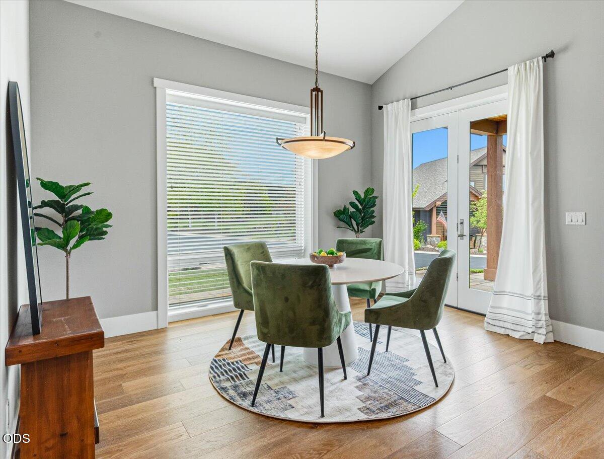 61333 Kindle Rock Loop Bend, OR 97702 - Photo 28 of 53 a view of a dining room with furniture window and wooden floor