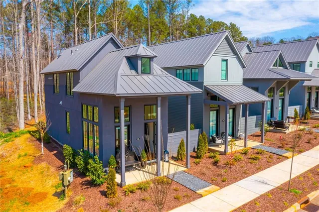 a view of a table and chairs in front of a house