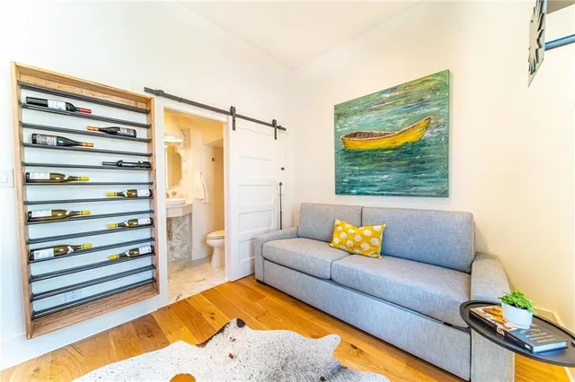 a living room with furniture and painting on the wall