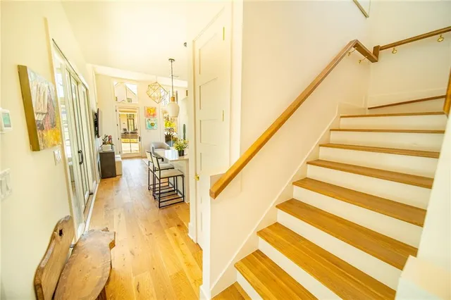 a view of a balcony with wooden floor and windows