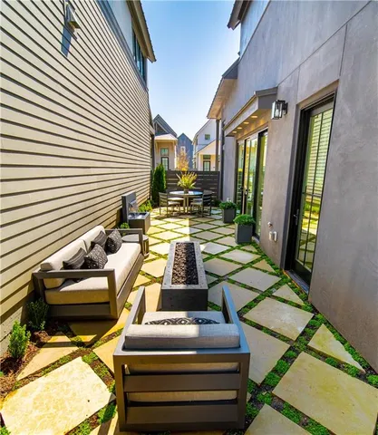 a view of a patio with swimming pool table and chairs