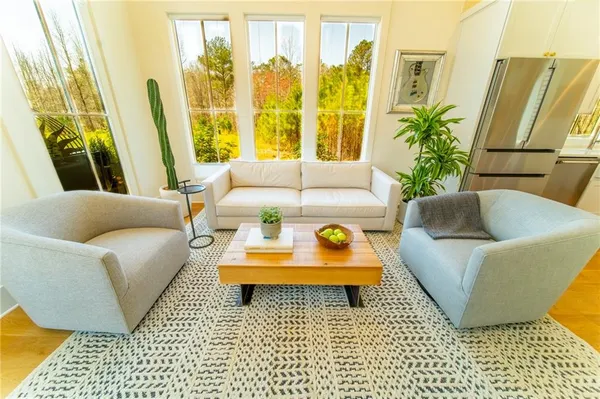 a living room with furniture and a rug