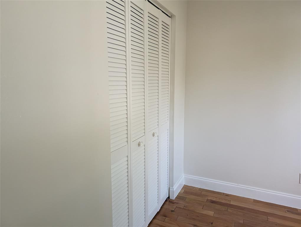 707 Southeast 3rd Avenue Dania Beach, FL 33004 - Photo 18 of 26 a view of a small space with wooden floor