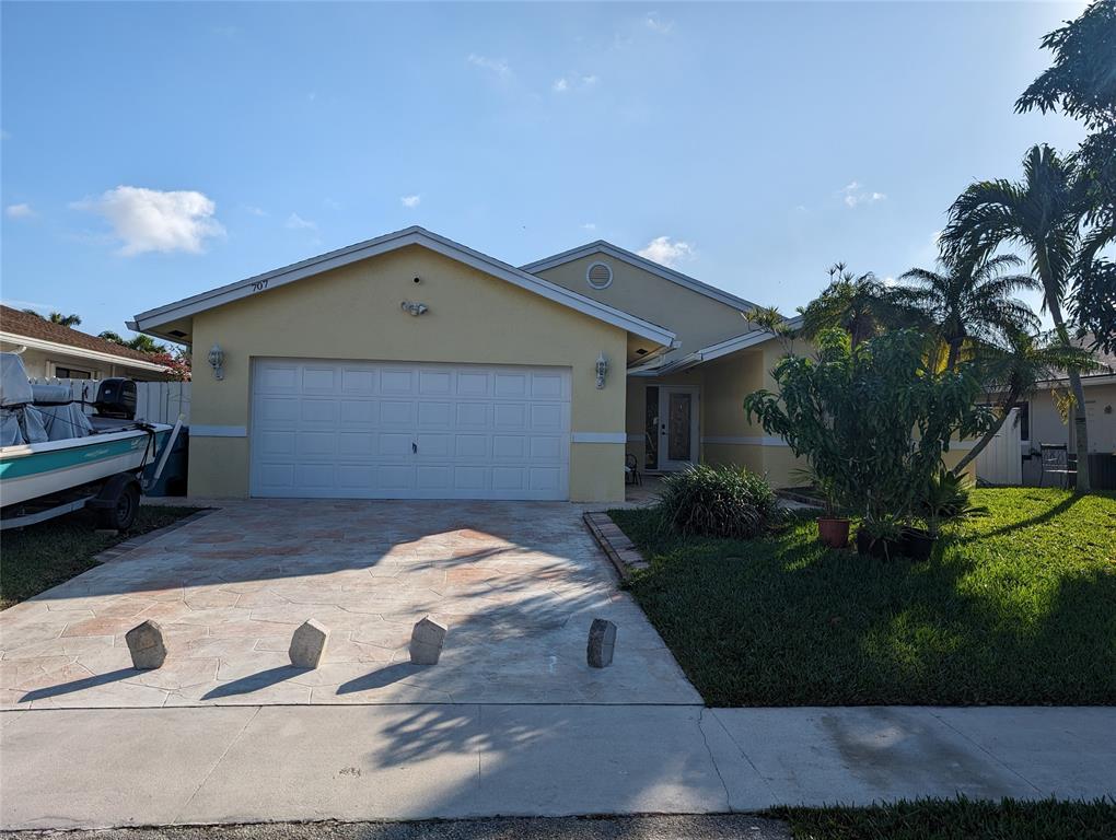 707 Southeast 3rd Avenue Dania Beach, FL 33004 - Photo 2 of 26 a house view with a backyard space