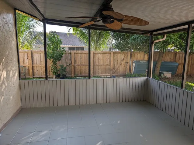 a view of porch with green trees