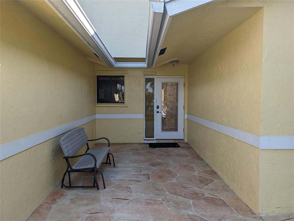 707 Southeast 3rd Avenue Dania Beach, FL 33004 - Photo 4 of 26 a view of a hallway with seating area