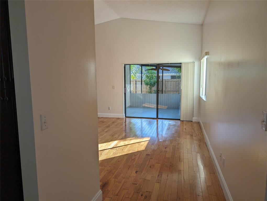 707 Southeast 3rd Avenue Dania Beach, FL 33004 - Photo 5 of 26 a view of livingroom with wooden floor