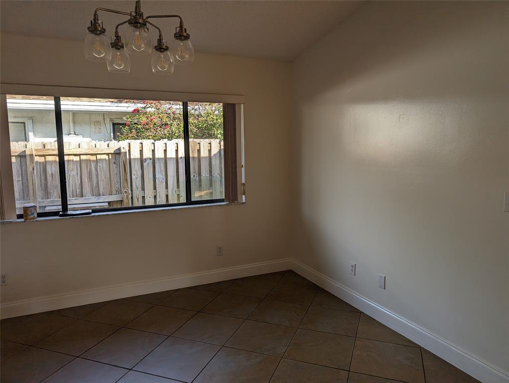 707 Southeast 3rd Avenue Dania Beach, FL 33004 - Photo 8 of 26 a view of an empty room with a window