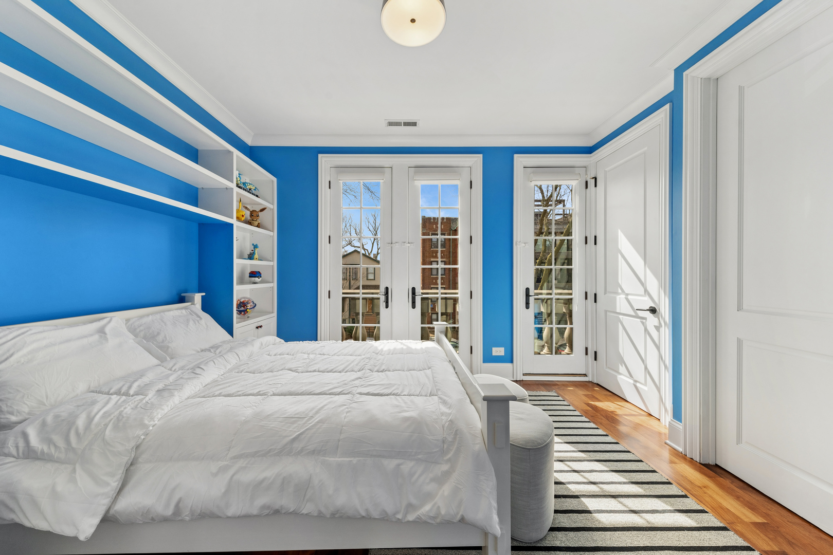 1460 West Byron Street Chicago, IL 60613 - Photo 15 of 33 a bedroom with a bed and a large window with balcony view