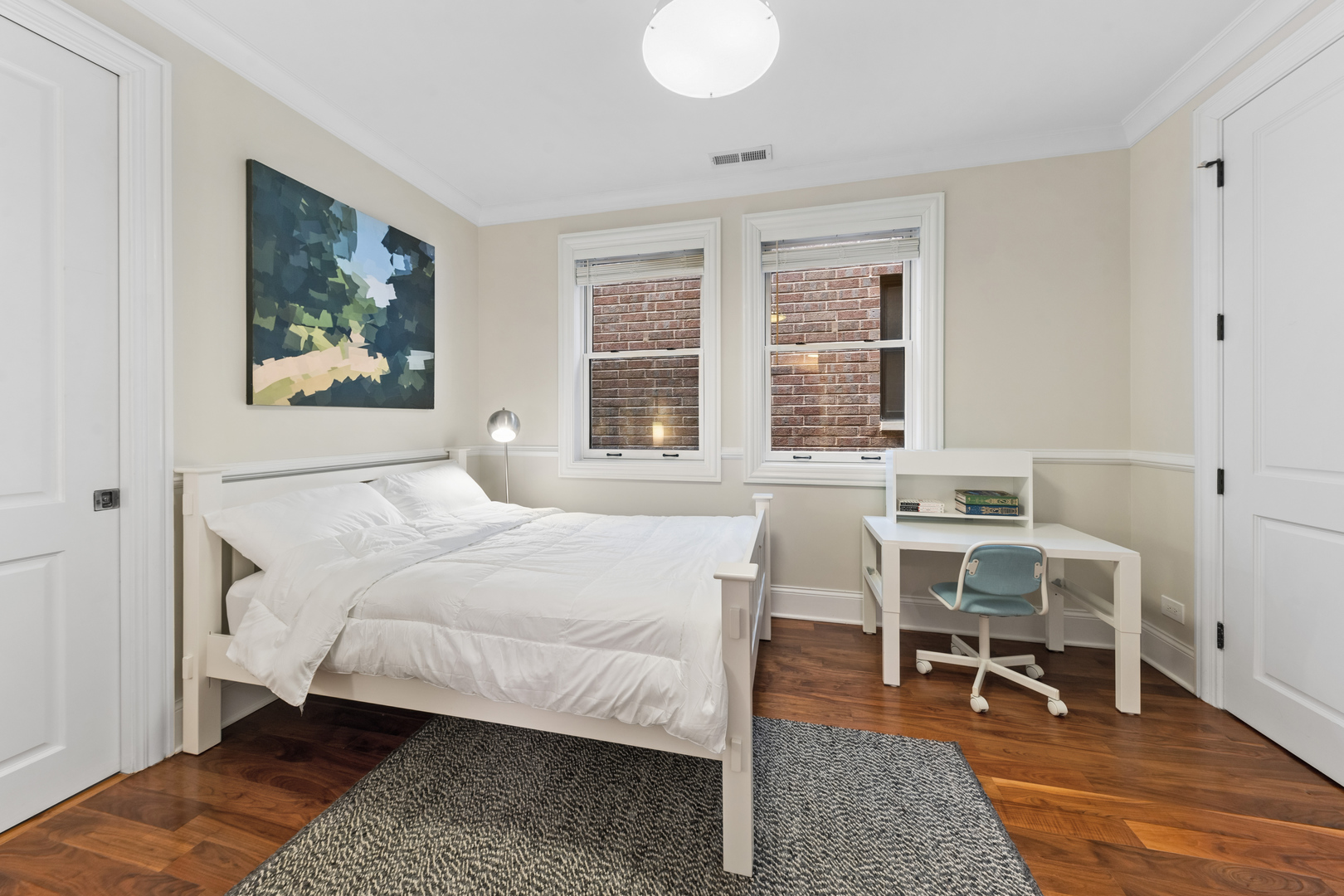 1460 West Byron Street Chicago, IL 60613 - Photo 17 of 33 a bedroom with a bed and a table in it