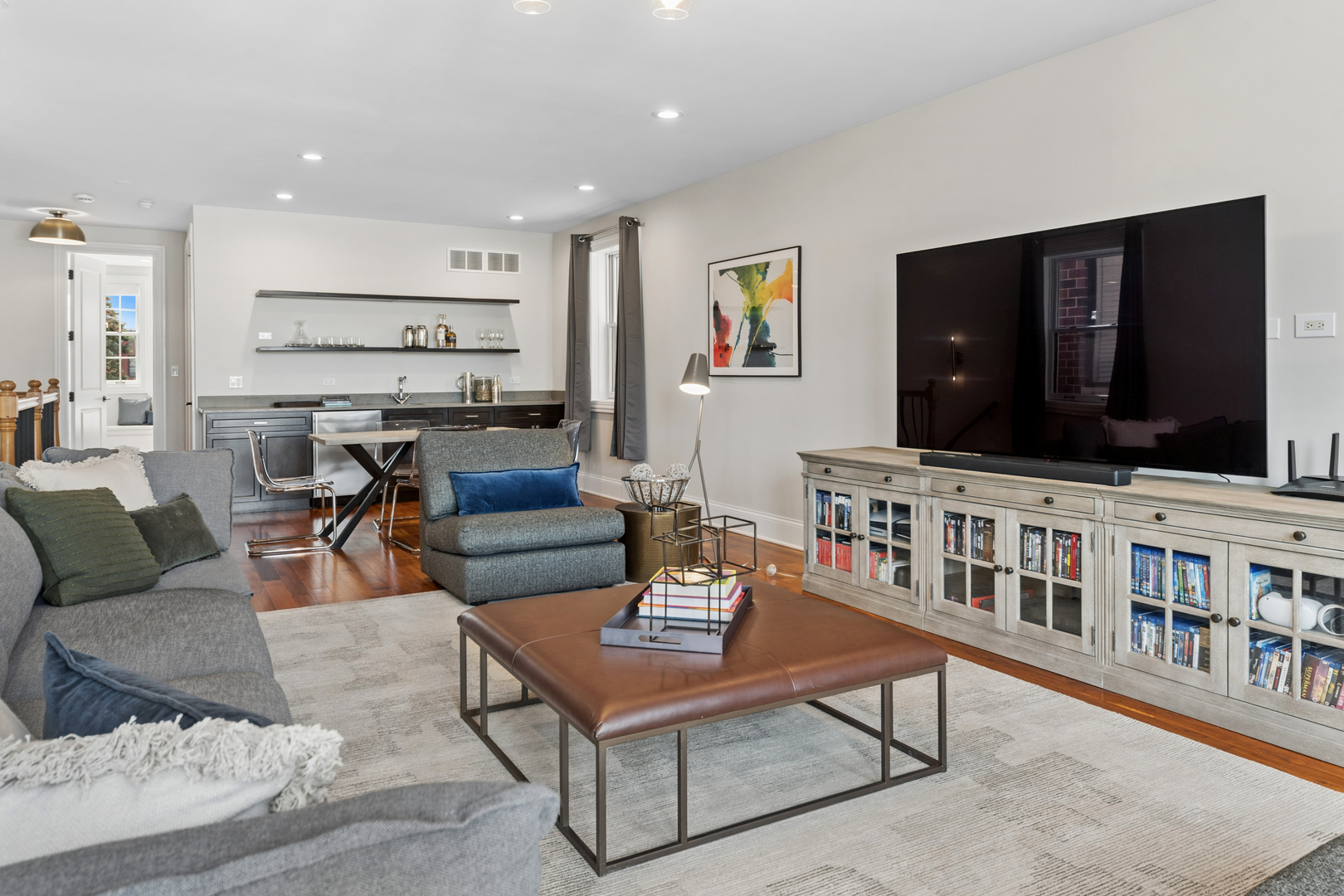 1460 West Byron Street Chicago, IL 60613 - Photo 22 of 33 a living room with furniture and a flat screen tv