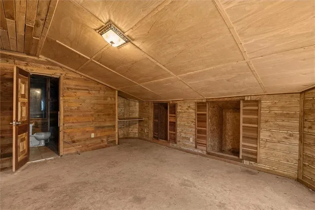 a bathroom with a toilet and shower