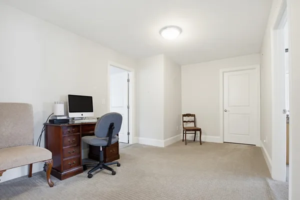 a workspace with furniture and a window