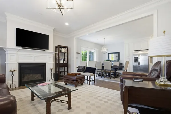 a living room with furniture fireplace and flat screen tv