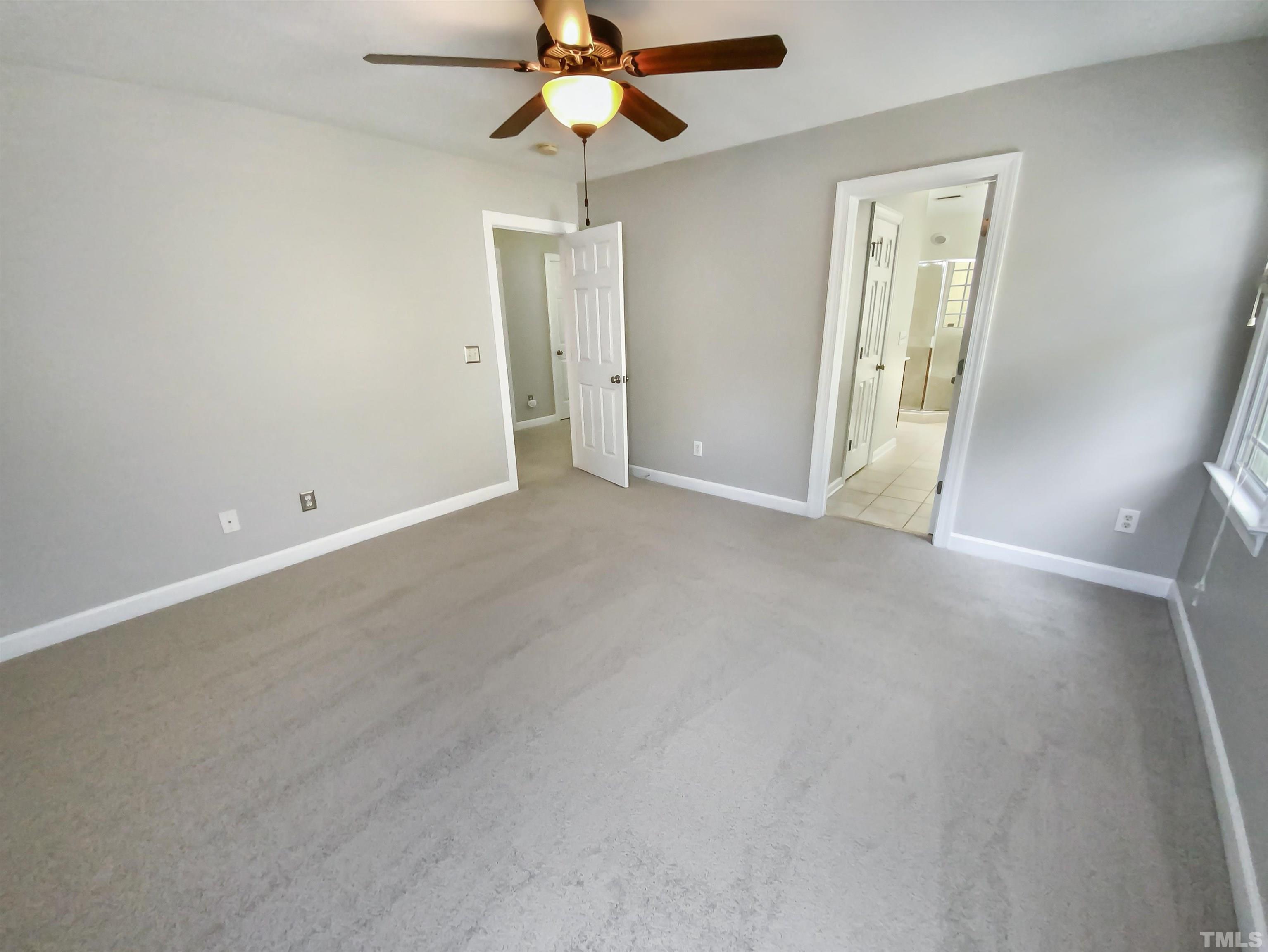 2106 Cloud Cover Lane Raleigh, NC 27614 - Photo 13 of 21 an empty room with closet and a chandelier fan