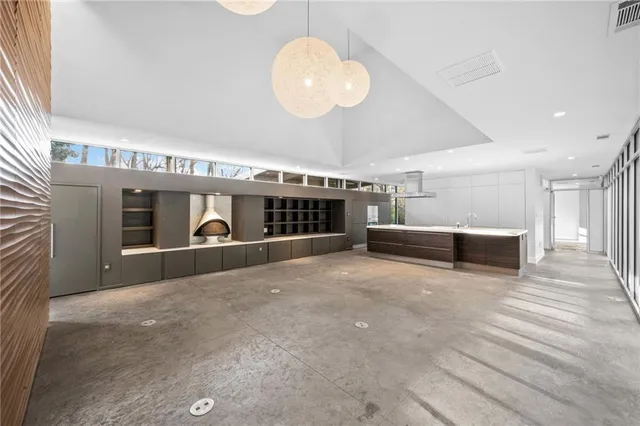 a view of an empty room with a fireplace