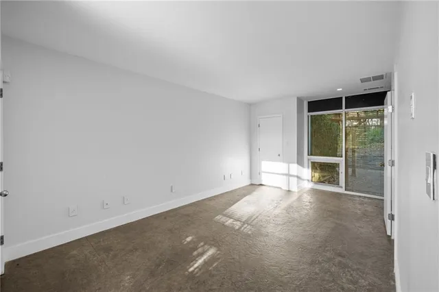 a view of an empty room with a window