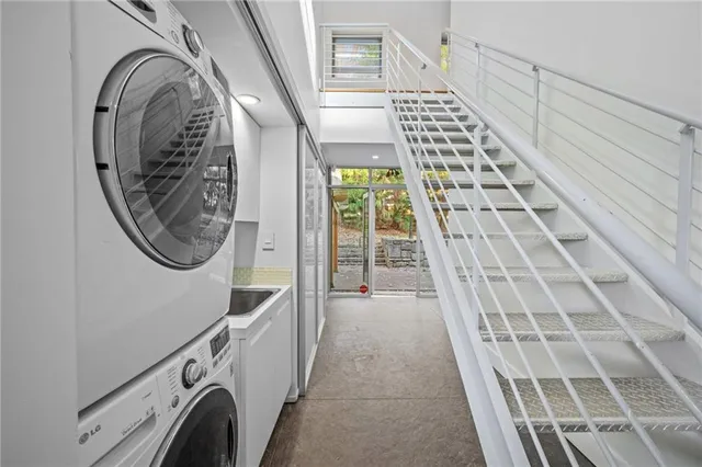 a view of a hallway with washer and dryer