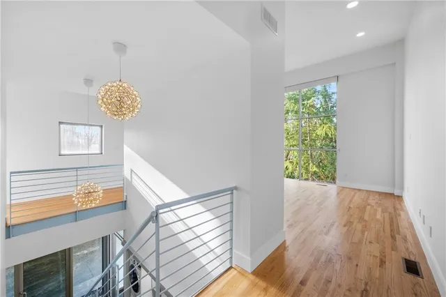 a view of an entryway with wooden floor