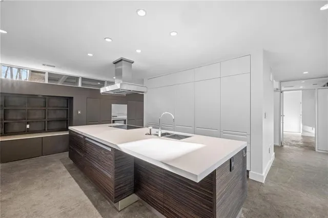 a kitchen with a stove and a refrigerator