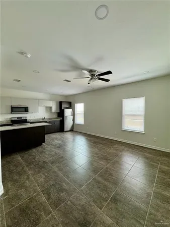 a view of kitchen with cabinets
