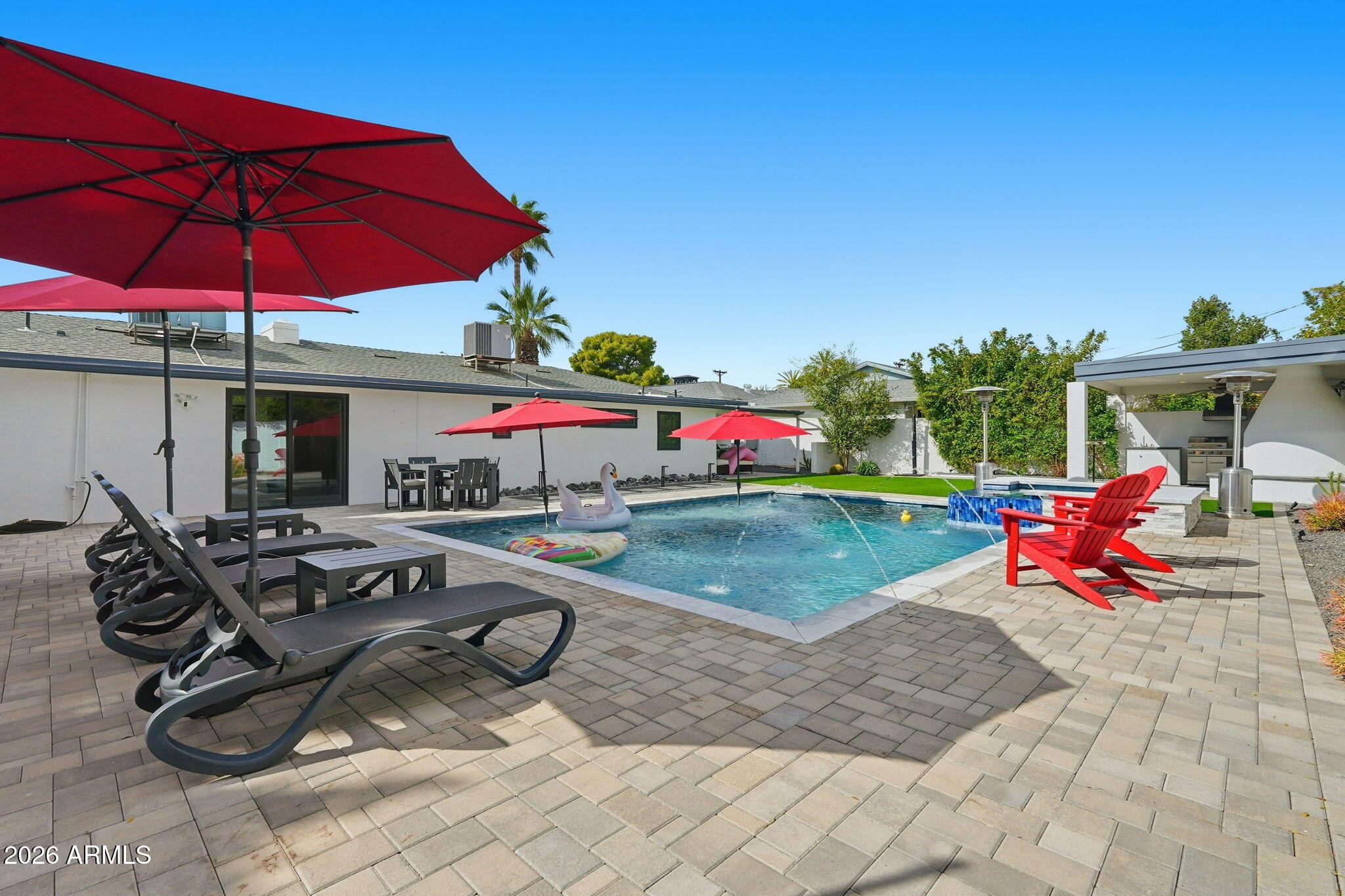 5149 North 34th Street Phoenix, AZ 85018 - Photo 55 of 70 a view of a patio with table and chairs under an umbrella