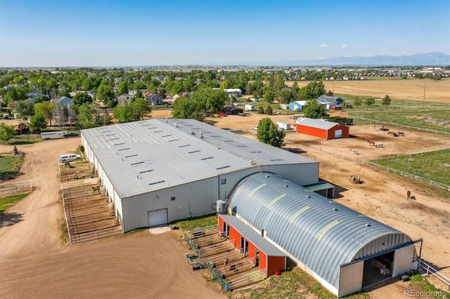a view of a swimming pool and an outdoor seating