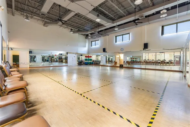 a large room with lots of table and chairs