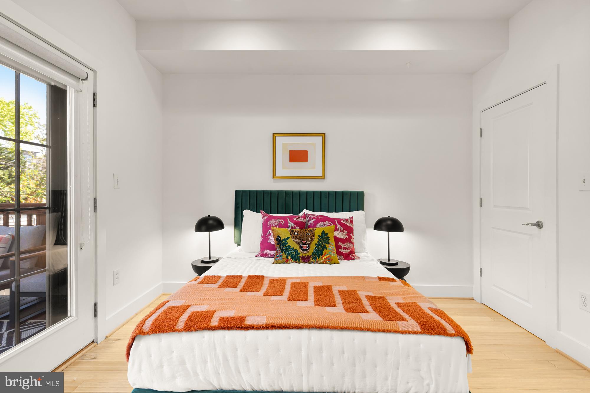 57 Bryant Street Northwest, Unit 2 Washington, DC 20001 - Photo 17 of 36 a bedroom with a bed and a window