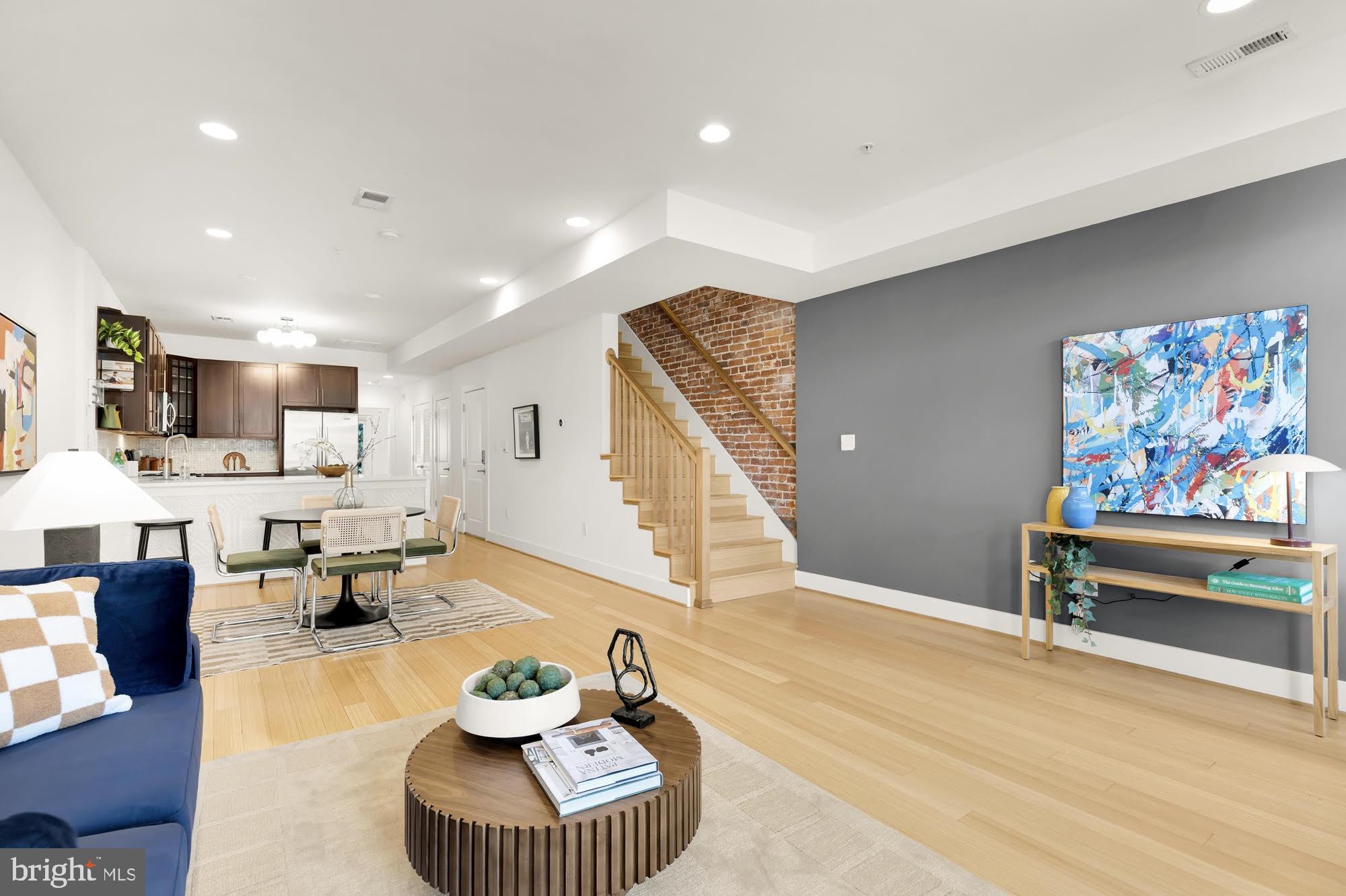 57 Bryant Street Northwest, Unit 2 Washington, DC 20001 - Photo 2 of 36 a living room with furniture and a wooden floor