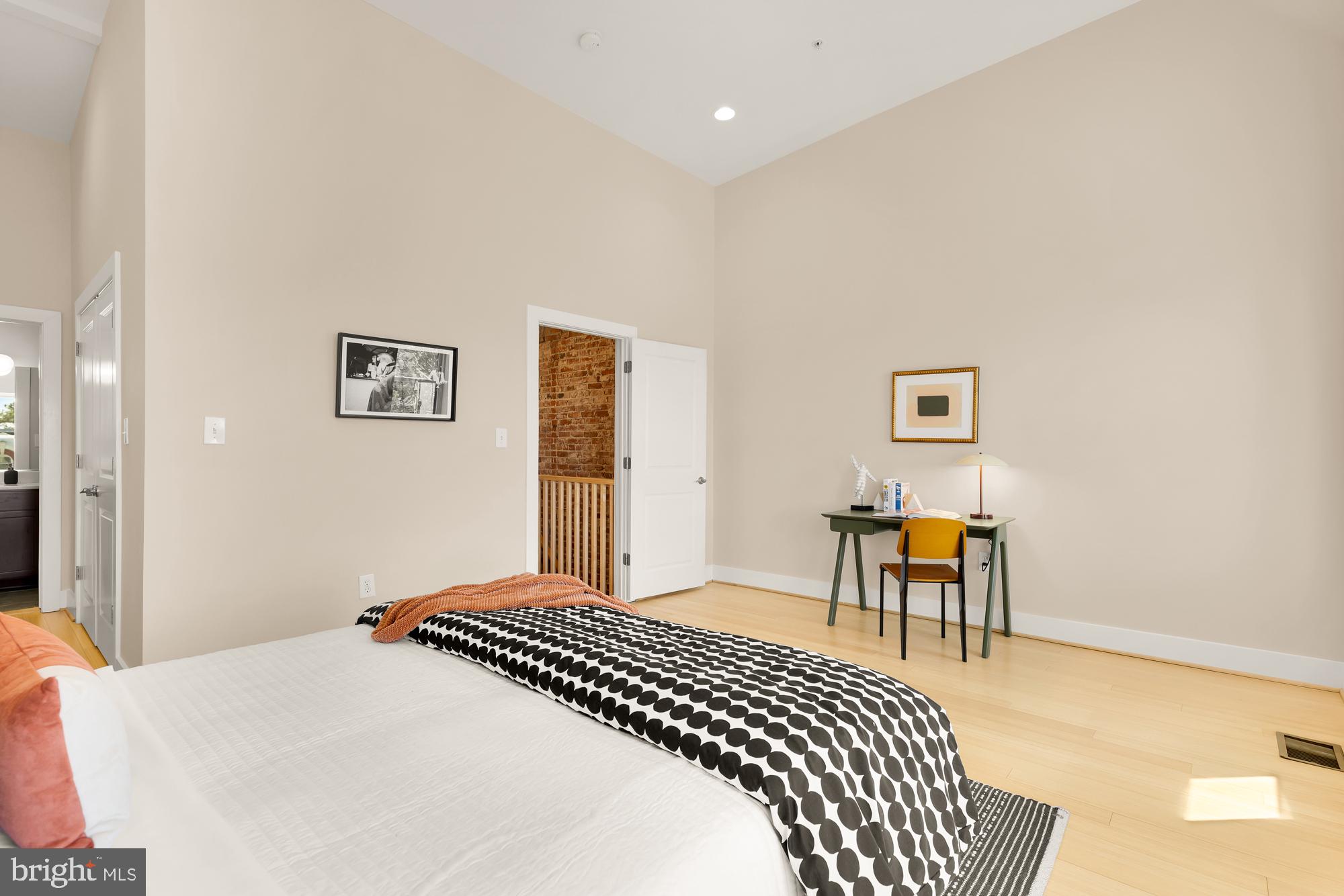 57 Bryant Street Northwest, Unit 2 Washington, DC 20001 - Photo 27 of 36 a bedroom with a bed and a table