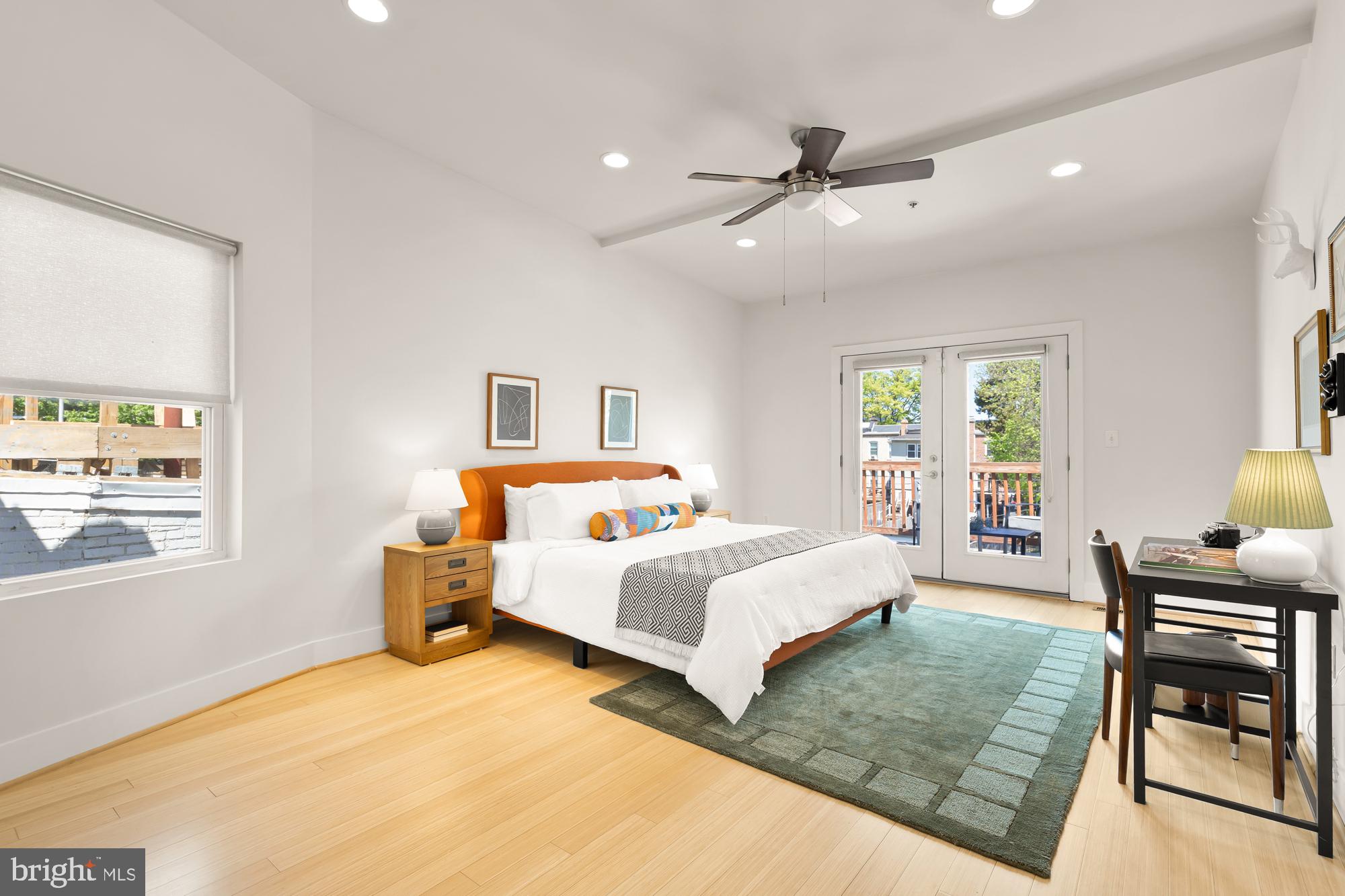 57 Bryant Street Northwest, Unit 2 Washington, DC 20001 - Photo 30 of 36 a bedroom with a bed window and table