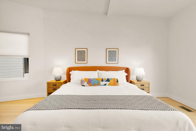 a bedroom with a bed and window