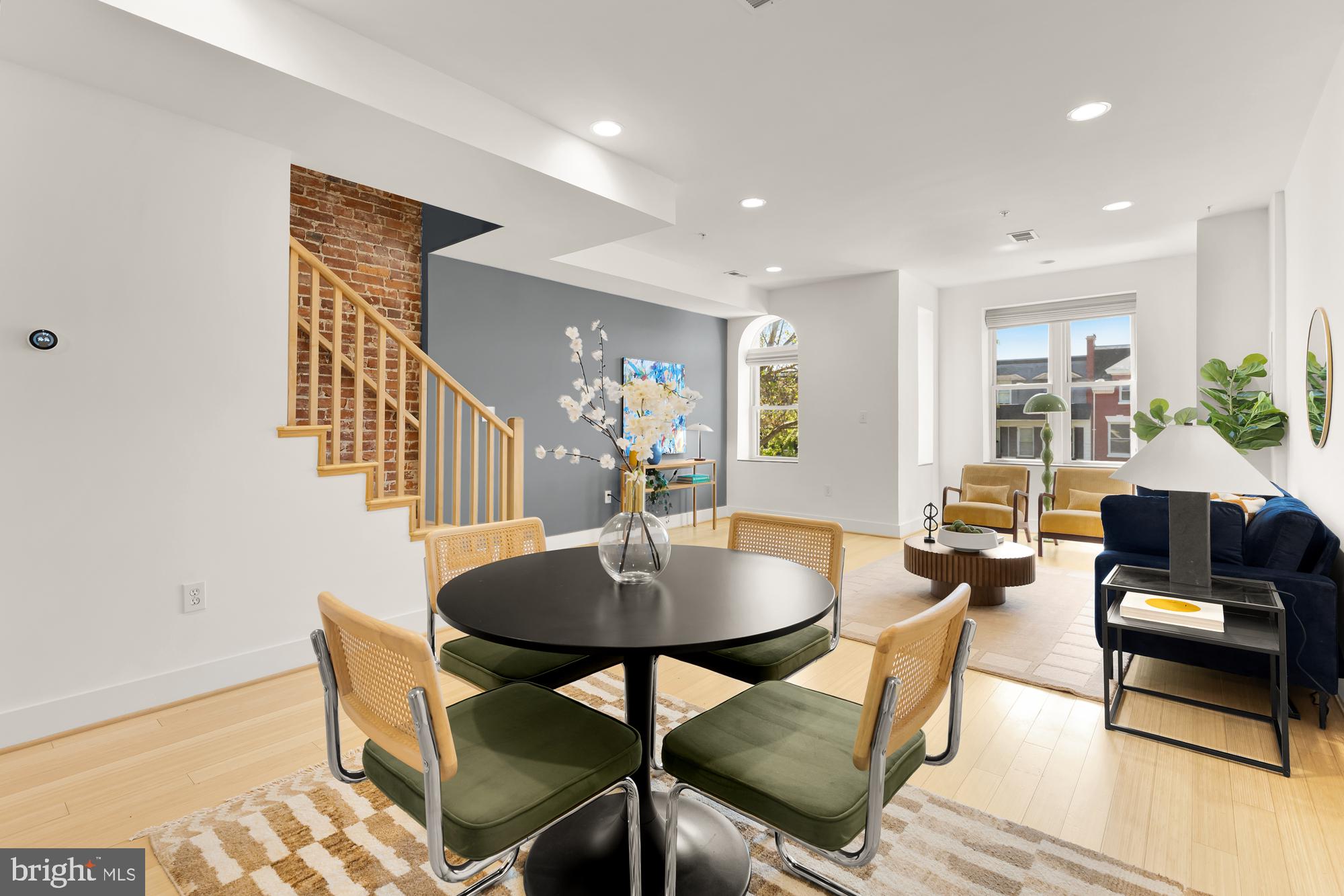 57 Bryant Street Northwest, Unit 2 Washington, DC 20001 - Photo 4 of 36 a living room with furniture and a table