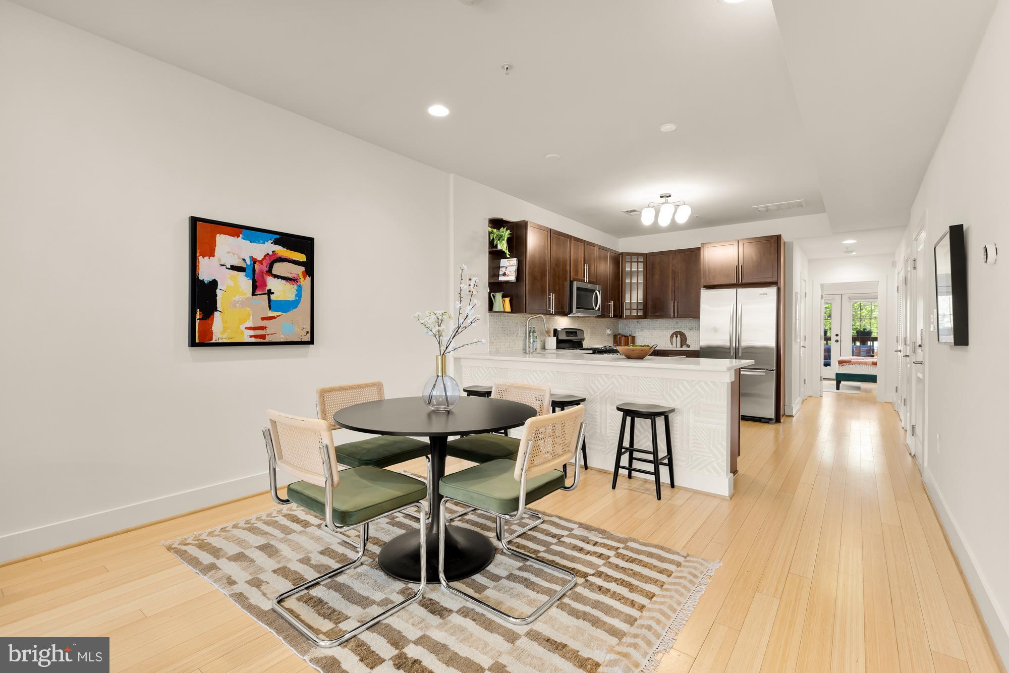 57 Bryant Street Northwest, Unit 2 Washington, DC 20001 - Photo 9 of 36 a living room with furniture and kitchen view