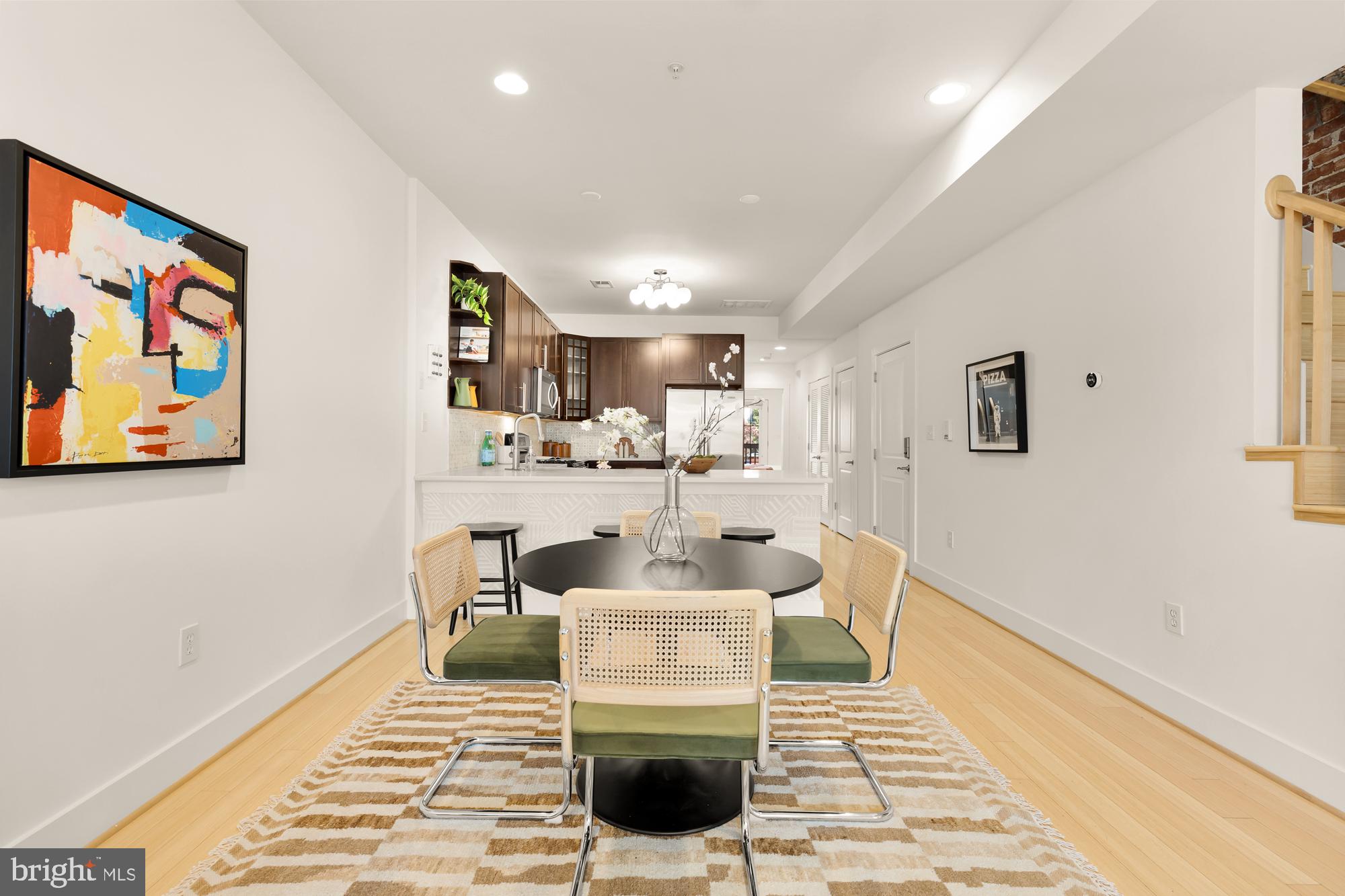 57 Bryant Street Northwest, Unit 2 Washington, DC 20001 - Photo 10 of 36 a living room with furniture and a rug