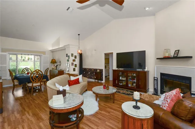a living room with fireplace furniture and a flat screen tv