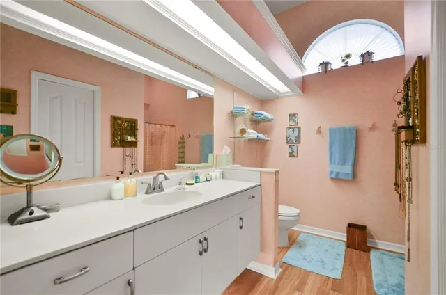 a bathroom with a sink double vanity and mirror