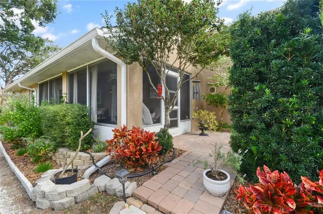 a view of a chairs and table in a patio