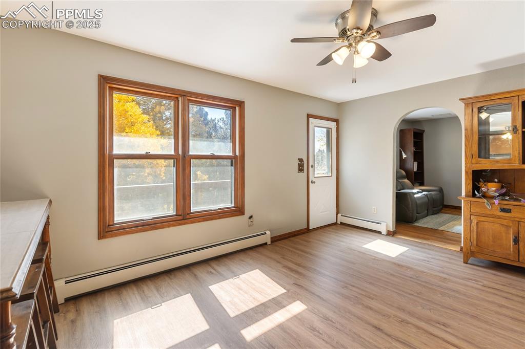 356 Spring Valley Drive Divide, CO 80814 - Photo 18 of 50 a view of an empty room with a window and wooden floor