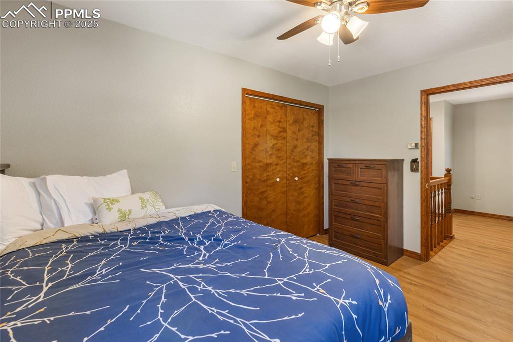 356 Spring Valley Drive Divide, CO 80814 - Photo 29 of 50 a bedroom with a bed and wooden floor