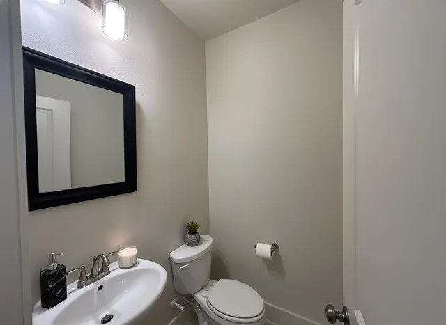 an empty room with a empty space and a ceiling fan