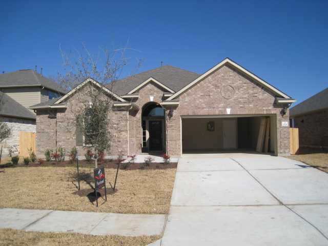2529 Mirasol Loop Round Rock, TX 78681 - Photo 1 of 1 a front view of a house with garden
