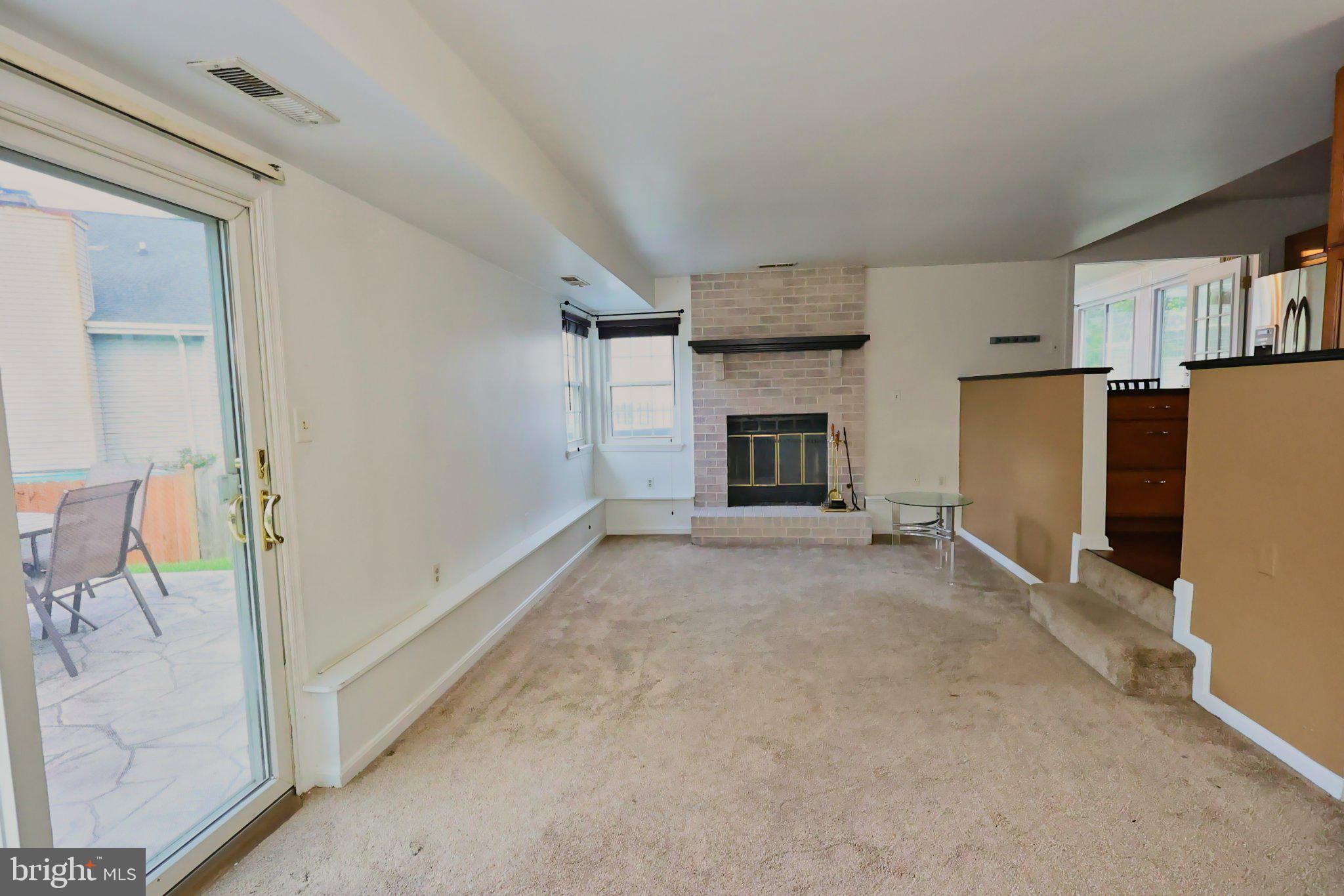 4402 Fieldgreen Road Nottingham, MD 21236 - Photo 28 of 52 Spacious living area with cozy fireplace.