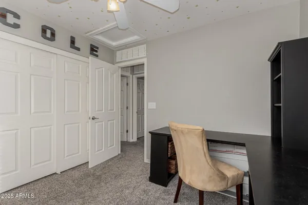 a workspace room with furniture