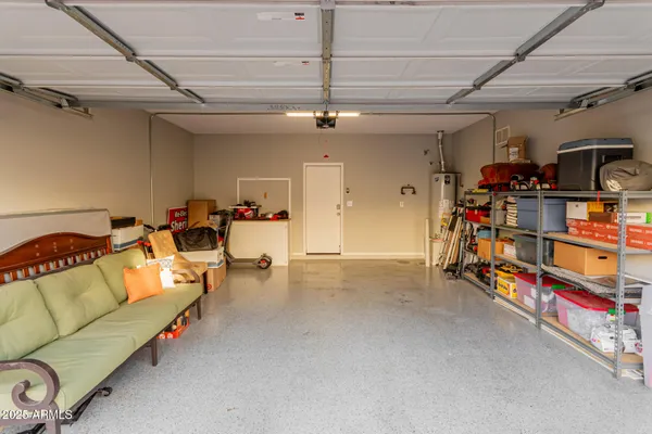 a bed room with a bed and a chair