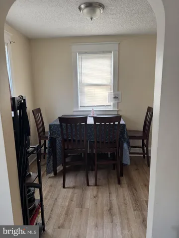 a view of a workspace with furniture and window