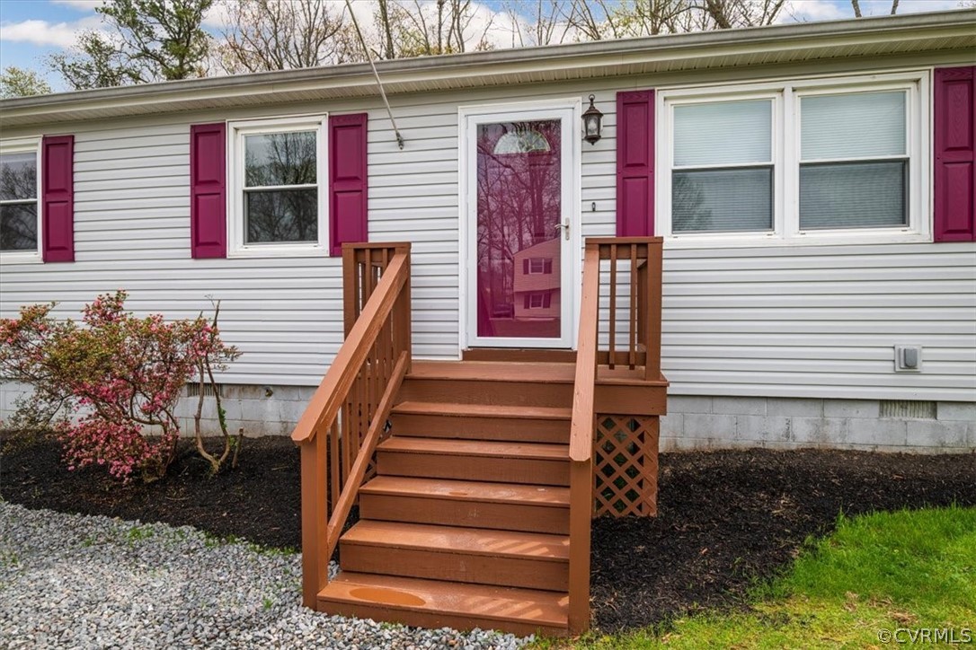 13900 Hackberry Road Chester, VA 23836 - Photo 3 of 41 a front view of a house with a yard